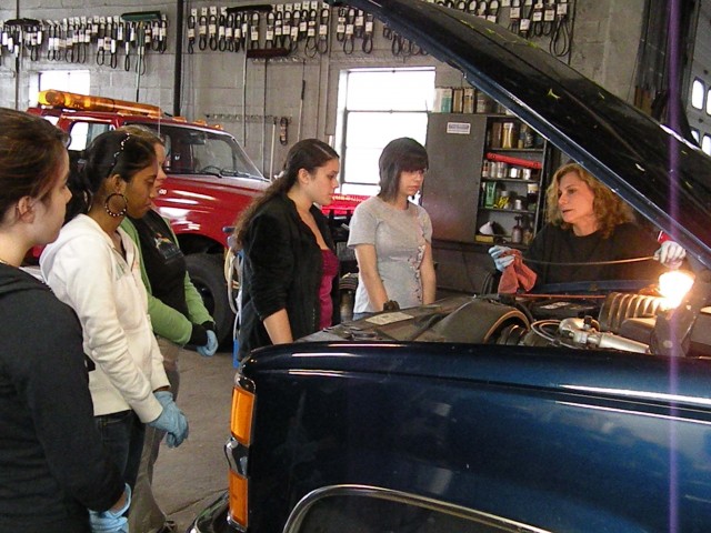 Team members learning in the shop